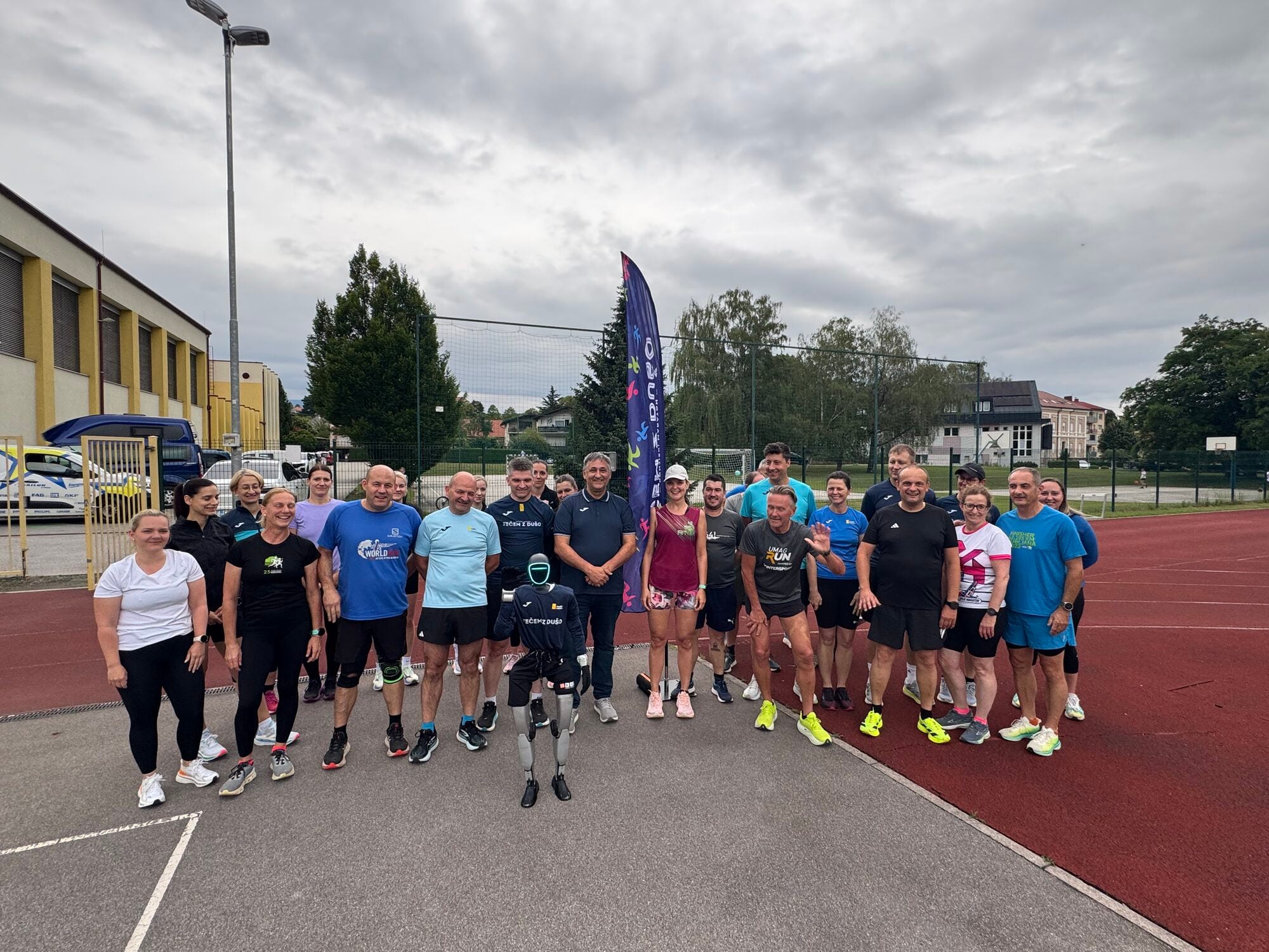 Humanoid robot Jože training with the Athletics School Konjice on the running track